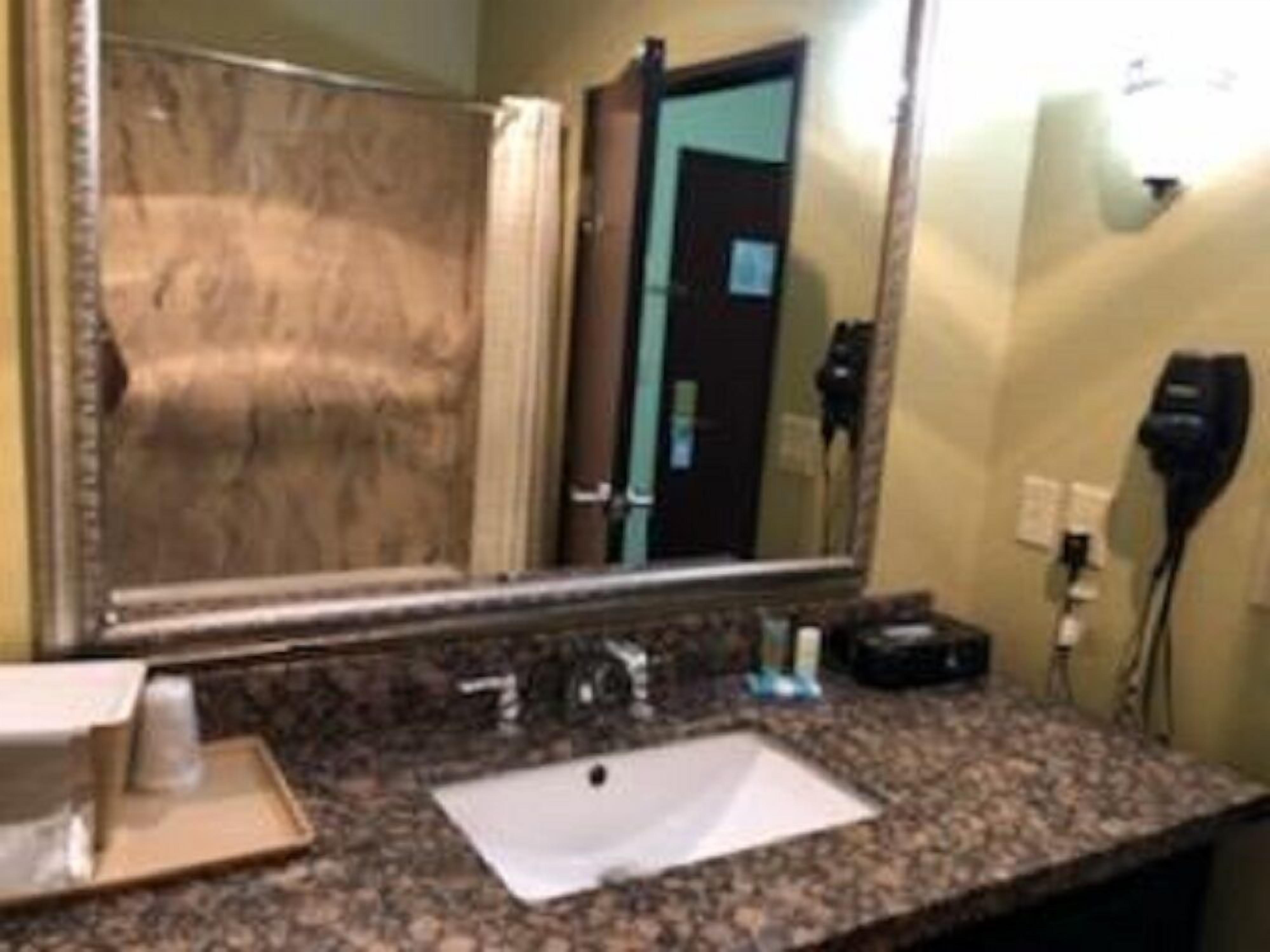 combined shower/bathtub, designer toiletries, hair dryer, towels