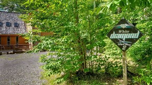 A sign for 'White Diamond North Face 2' amidst lush greenery. - White Diamond (Davis)