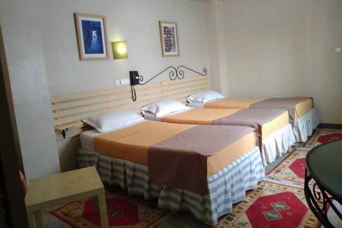 Standard Triple Room | Desk, blackout drapes, free cribs/infant beds, free WiFi