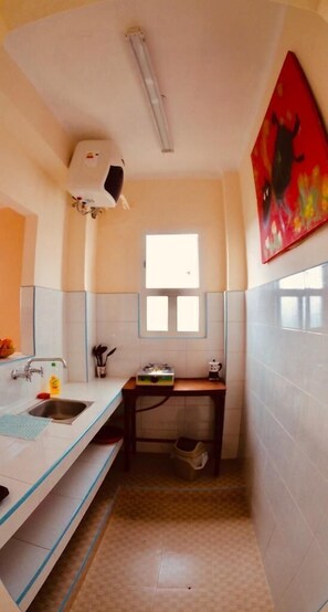 Apartment, 2 Bedrooms | Private kitchen | Full-size fridge, stovetop, coffee/tea maker, cookware/dishes/utensils