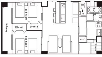 A hotel floor plan with a balcony, two bedrooms, a bathroom, a WC, a closet, and an entrance.