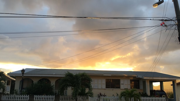 A two-story building with a flat roof and a covered porch. - Liamuiga Drive Inn (Basseterre)