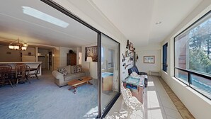 A spacious living area with a sofa, coffee table, and a dining area with chairs and a table. - Great 2 Bedroom Condo with Amazing Views! Access to Hot Tubs and Heated Pool! (Unit 307 at 1849) by RedAwning (Mammoth Lakes)