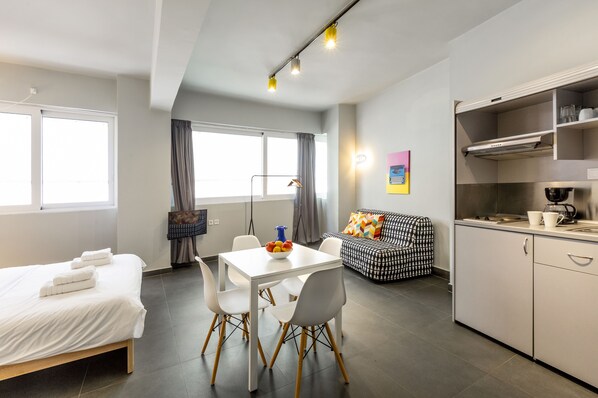 Studio, City View (A4) | Living area | Flat-screen TV