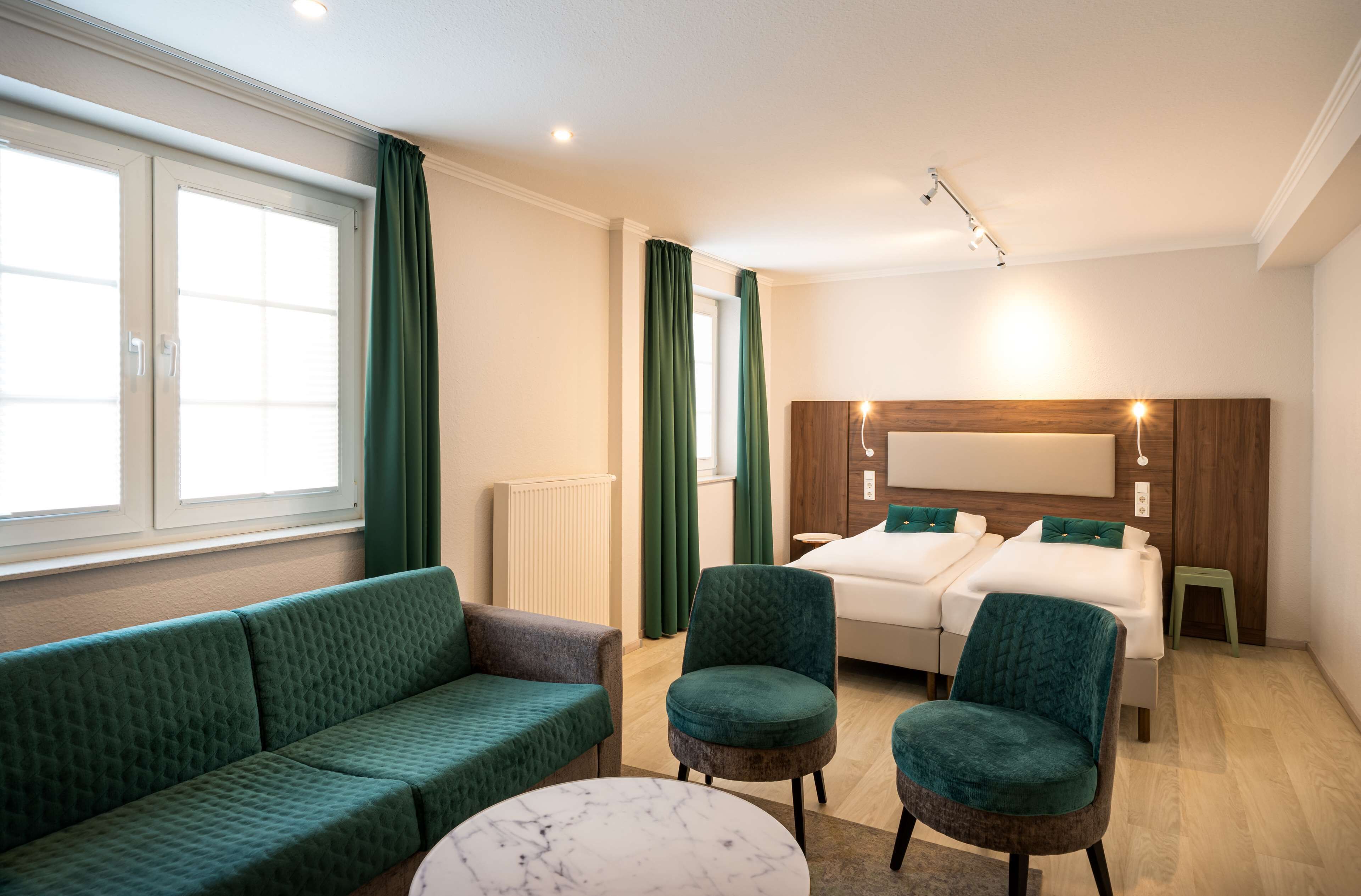 deluxe double room | in-room safe, desk, laptop workspace, blackout curtains