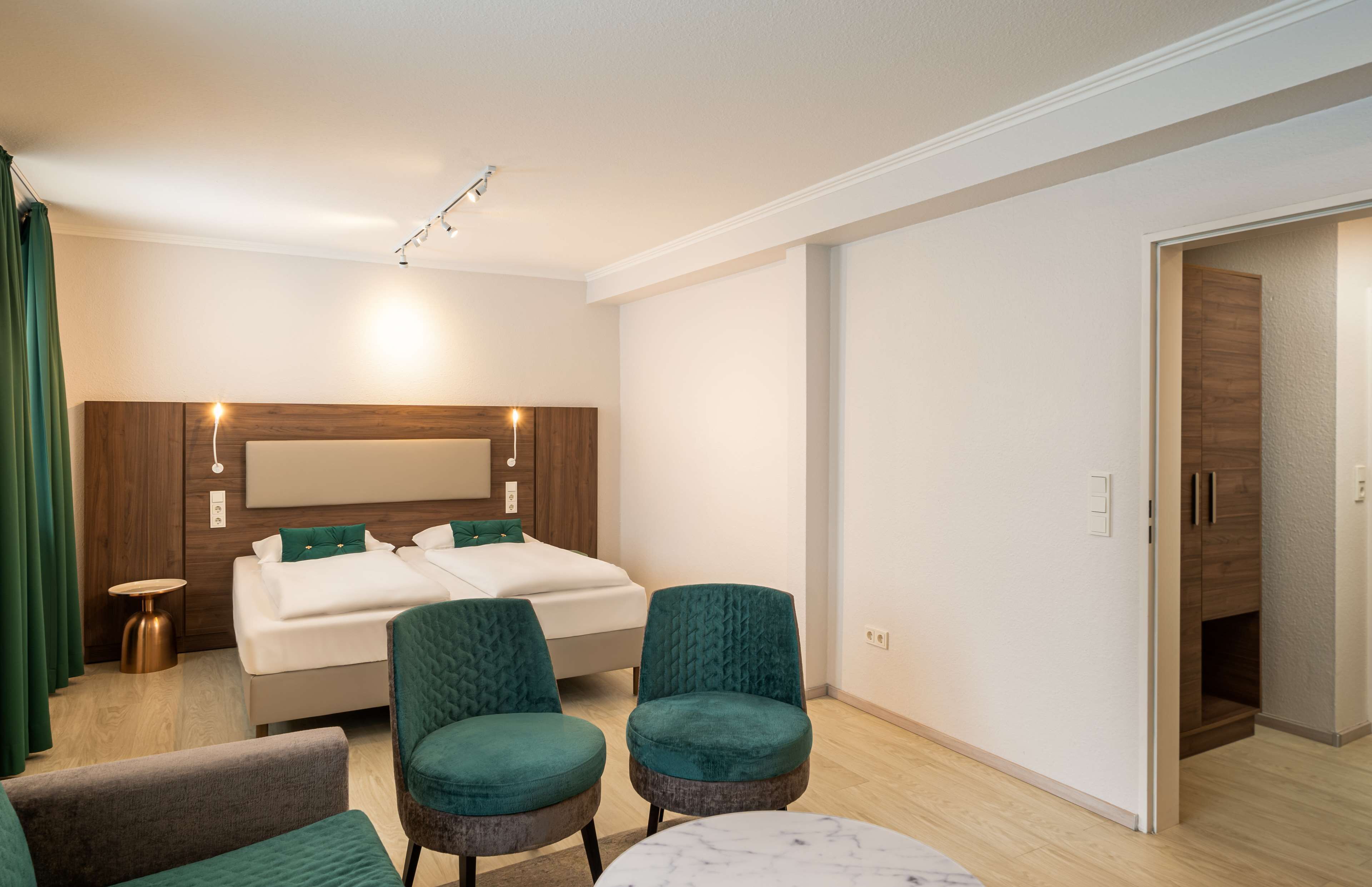 deluxe double room | in-room safe, desk, laptop workspace, blackout curtains