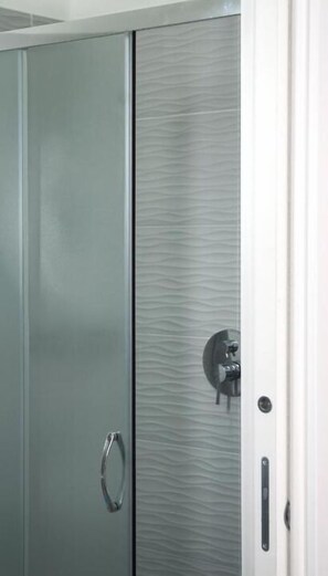 A metallic wardrobe with a handle and a lock mechanism. - Voglia di Napoli (Naples)