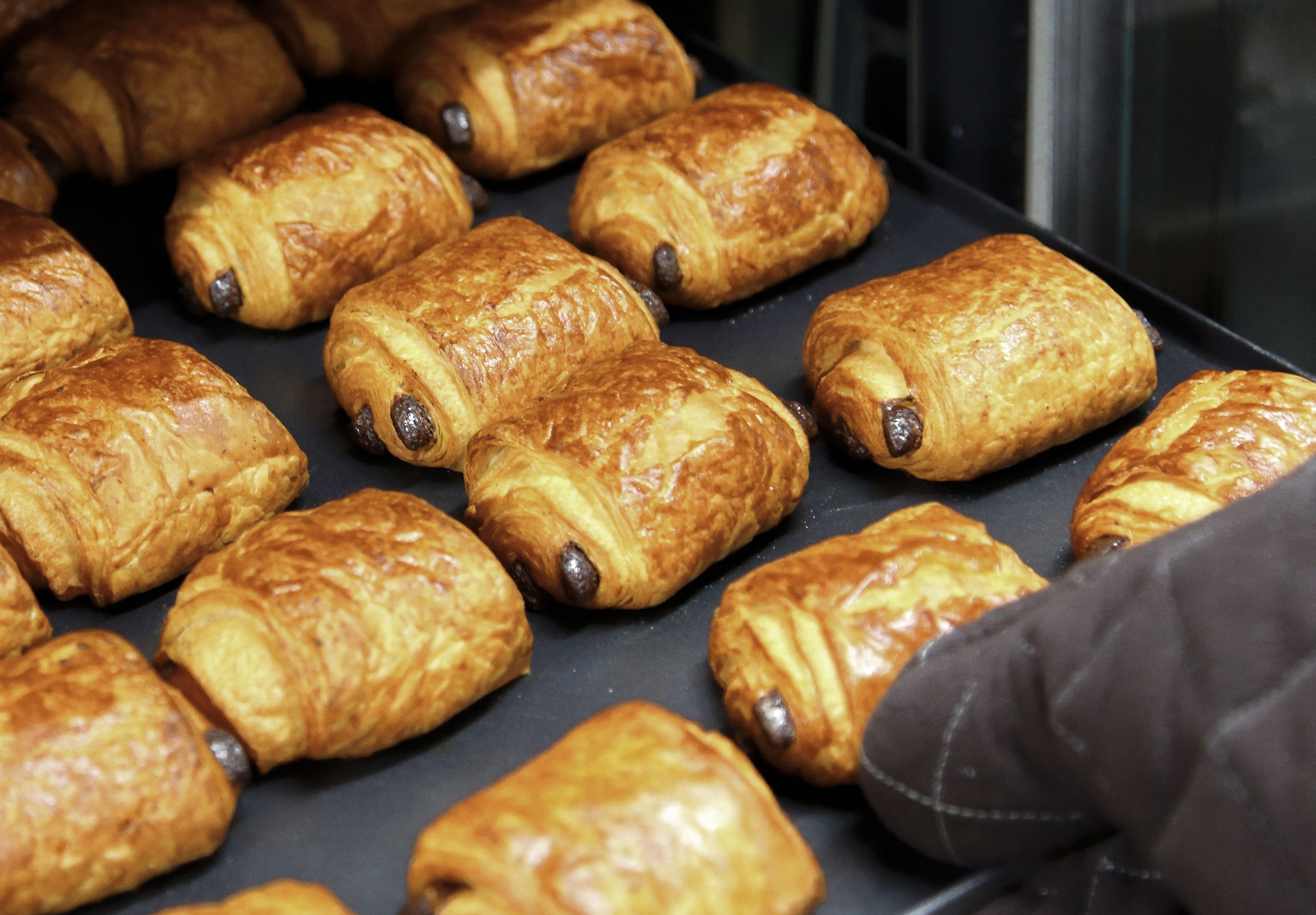 A tray of freshly baked croissants.