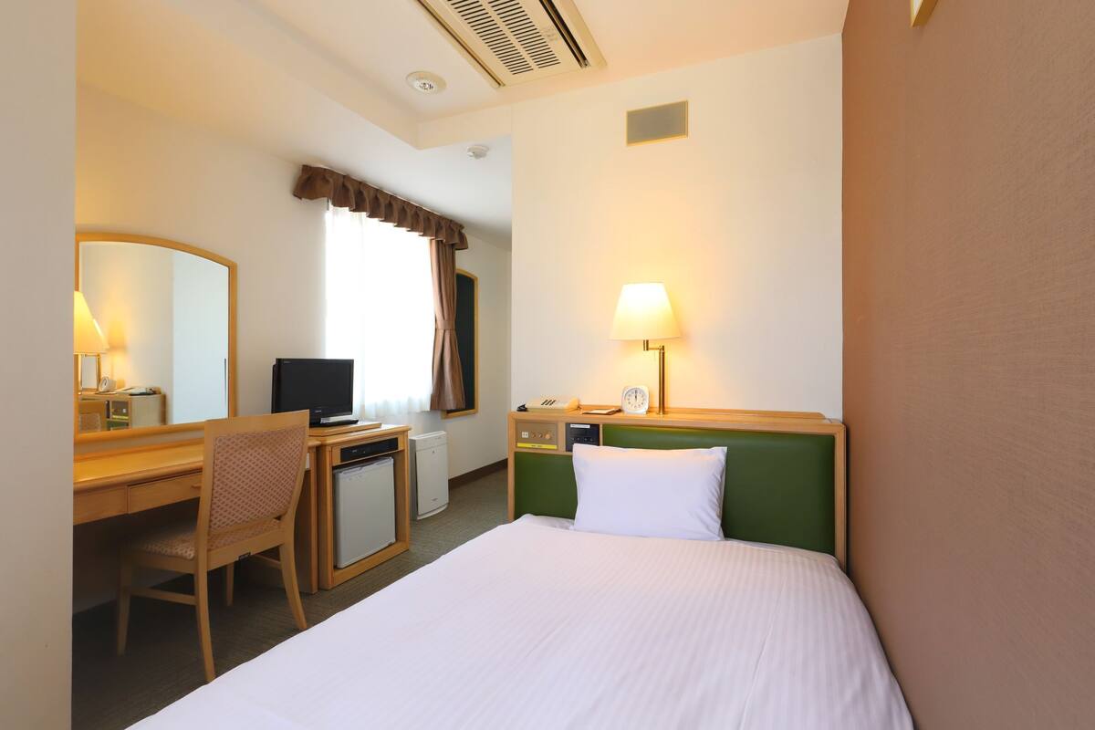Desk, blackout curtains, iron/ironing board (on request), free WiFi