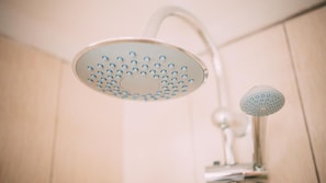 A showerhead with a circular design and multiple nozzles. - Thomas Apartments (Ayia Napa)