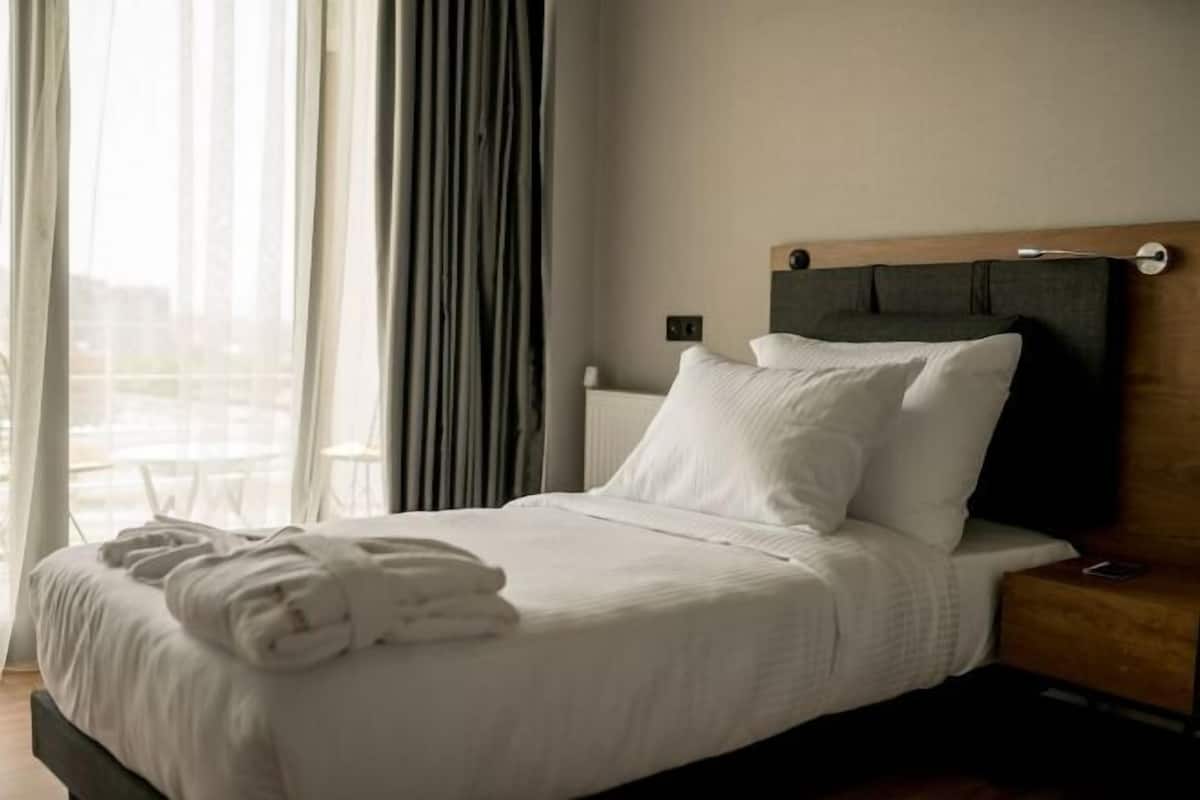 Premium bedding, memory-foam beds, minibar, laptop workspace