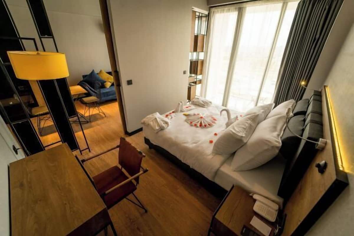 Premium bedding, memory foam beds, minibar, laptop workspace