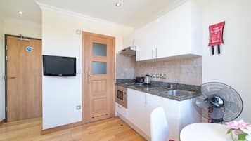 One-Bedroom Apartment (3 Adults) | Private kitchen | Fridge, microwave, stovetop, coffee/tea maker