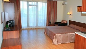 Standard Double Room, Balcony, Park View | Minibar, in-room safe, desk, iron/ironing board