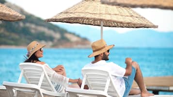 Private beach, black sand, beach shuttle, sun-loungers