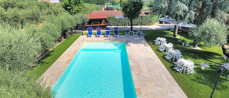 Outdoor pool, pool umbrellas, sun loungers