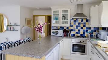 Bungalow, 2 Bedrooms | Private kitchen | Full-size fridge, microwave, oven, stovetop