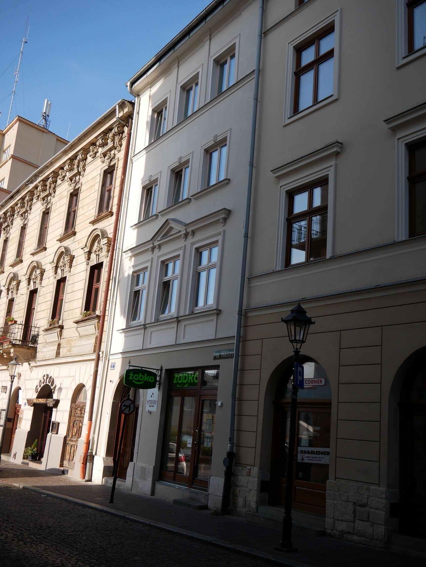 A street view of a building with a shop named 'Zadro' and a sign for 'Gospoda'.