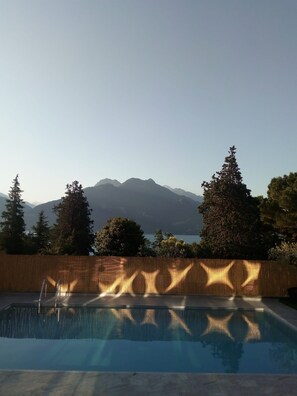 Seasonal outdoor pool, pool umbrellas, pool loungers
