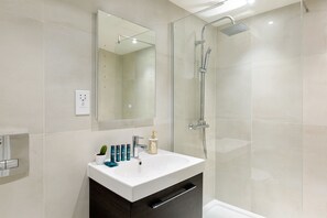 Apartment, Multiple Beds (154c) | Bathroom | Shower, free toiletries, hair dryer, towels