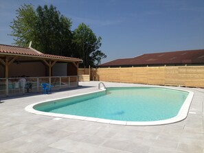 Seasonal outdoor pool, open 10:30 AM to 7:00 PM, pool umbrellas