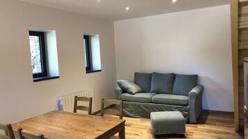 Comfort appartement | Woonkamer | Flatscreentelevisie