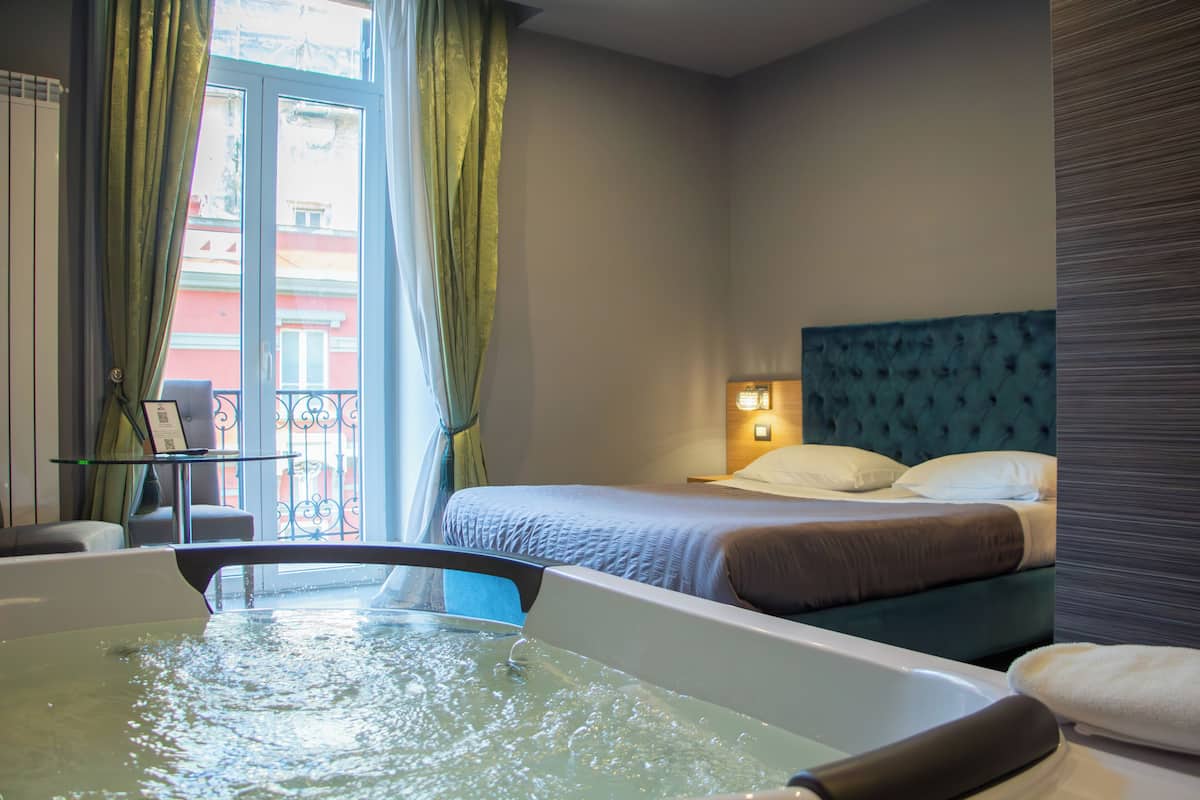 Deluxe Room, 1 Queen Bed, Jetted Tub, City View | 1 bedroom, premium bedding, desk, blackout drapes