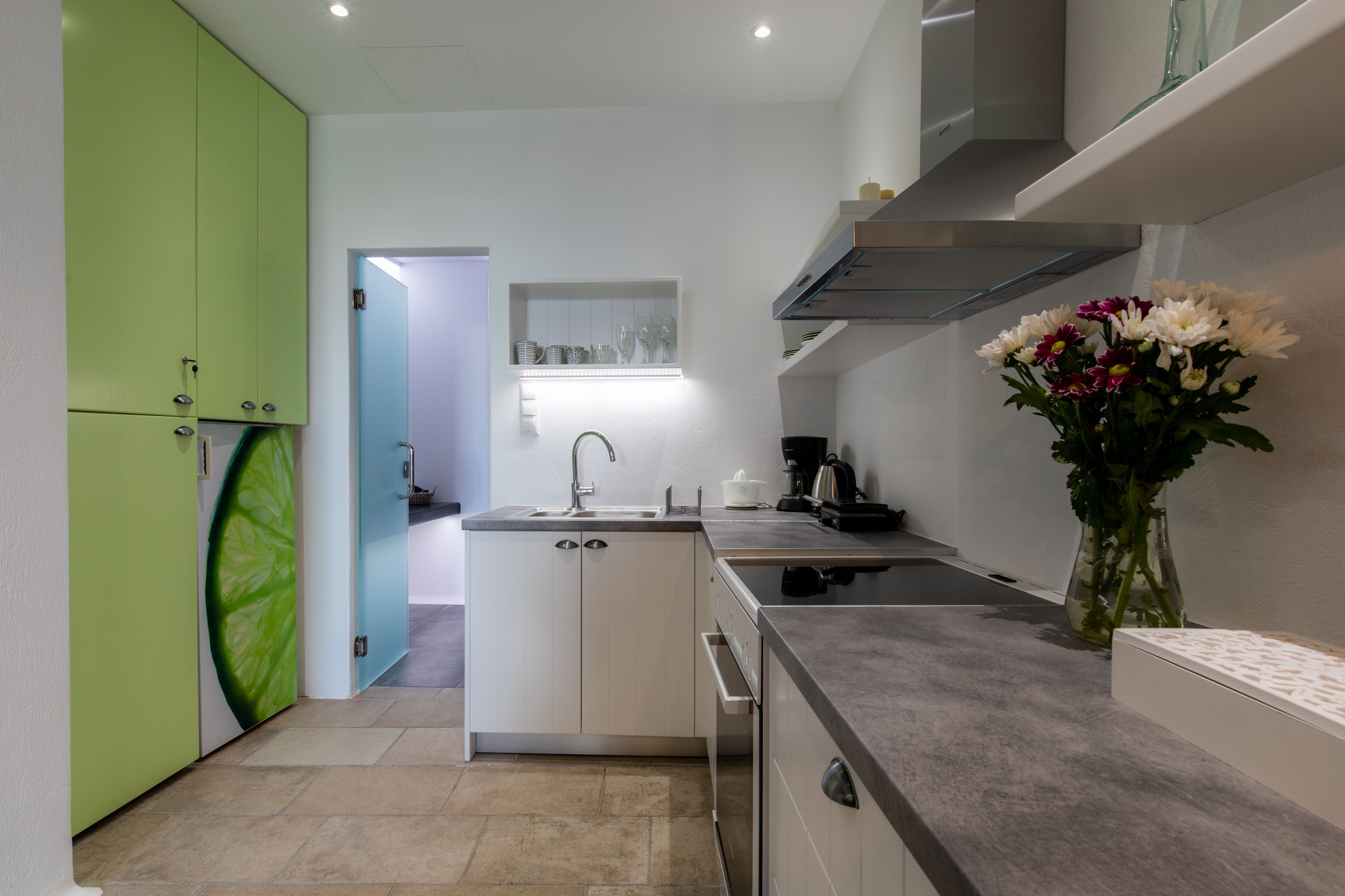 executive apartment, courtyard view | private kitchen | stovetop, coffee/tea maker, electric kettle, cookware/dishes/utensils