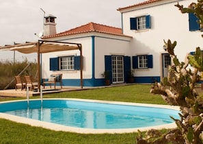 Outdoor pool, open 8:00 AM to 8:00 PM, pool umbrellas, pool loungers