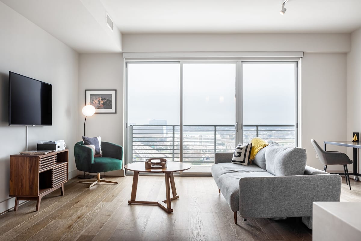 One Bedroom Apartment | Living area | 55-inch flat-screen TV with cable channels, TV