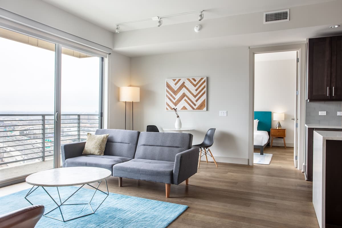 Premium Two Bedroom Apartment, City View | Living area | 55-inch flat-screen TV with cable channels, TV