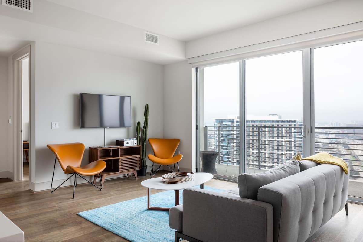 Premium Two Bedroom Apartment | Living area | 55-inch flat-screen TV with cable channels, TV