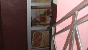 A bar and restaurant sign with images of food. - Hôtel 2S (Douala)