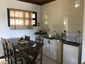 Fridge, microwave, coffee/tea maker, cookware/dishes/utensils