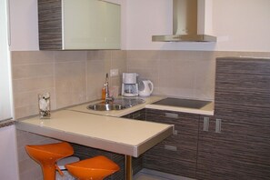 Fridge, coffee/tea maker, electric kettle, toaster