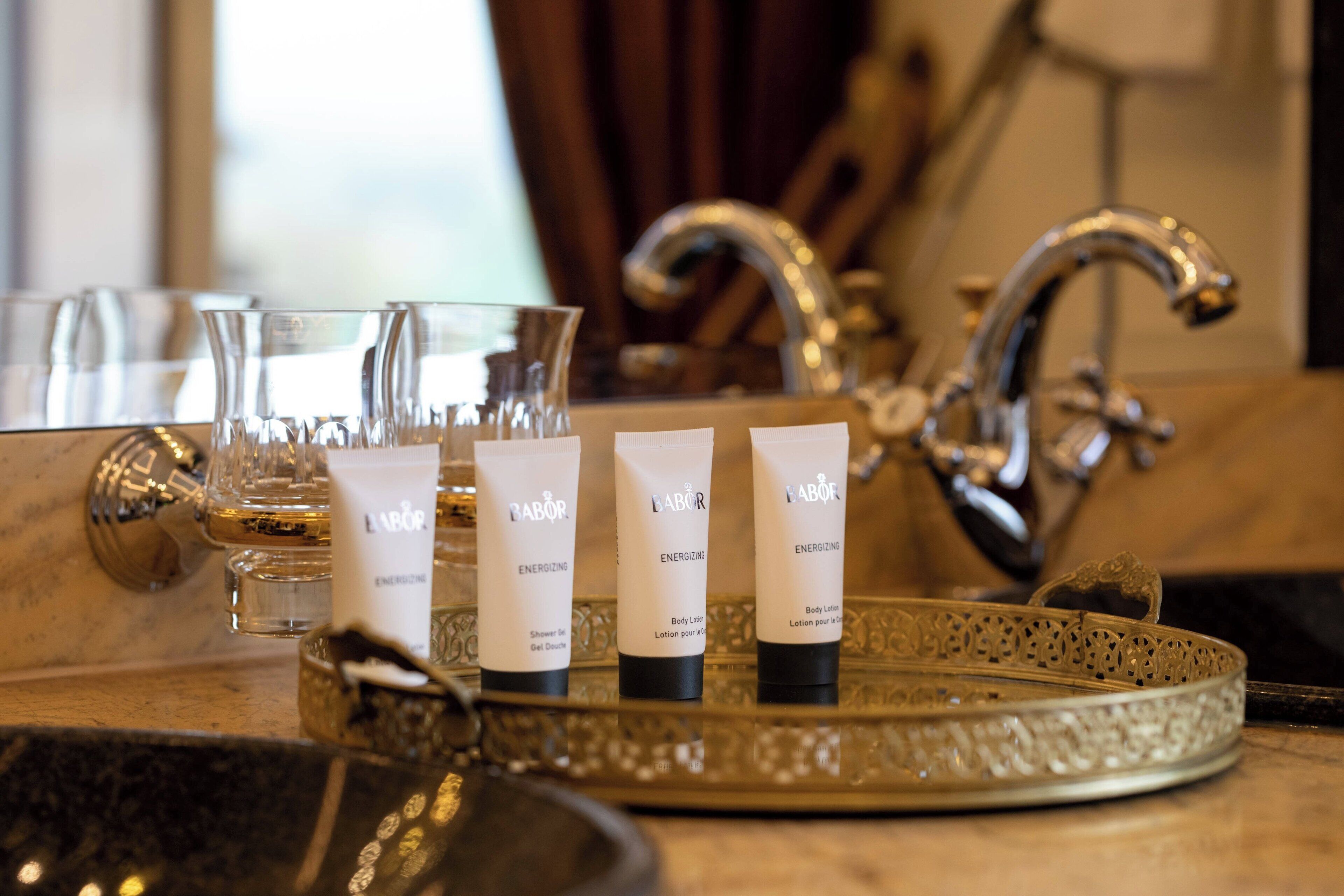 combined shower/bathtub, designer toiletries, hair dryer, bathrobes