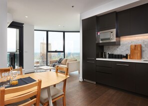 Deluxe Apartment, 2 Bedrooms, City View | Living area | LED TV - Designer Getaway with Breathtaking Views (Box Hill)