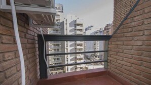 A narrow balcony with a view of adjacent buildings. - Obispo Salguero 21A (Córdoba)