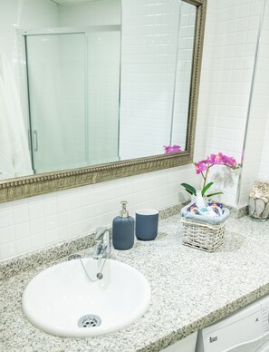 Shower, hair dryer, towels, soap