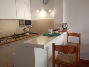 Fridge, microwave, coffee/tea maker, electric kettle