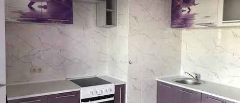 Fridge, electric kettle, cookware/dishes/utensils