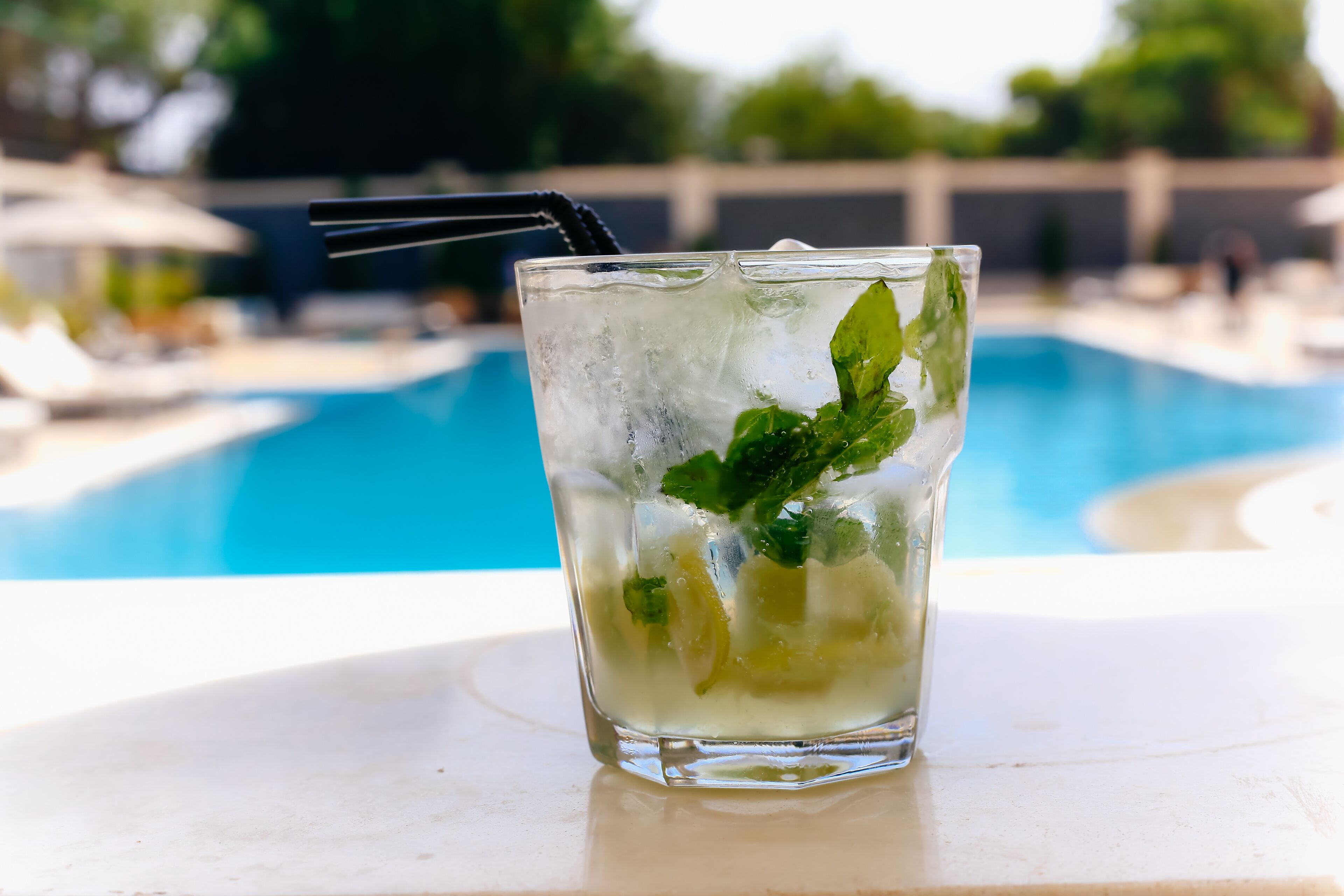 outdoor pool, open 7:00 am to 7:00 pm, pool umbrellas, pool loungers