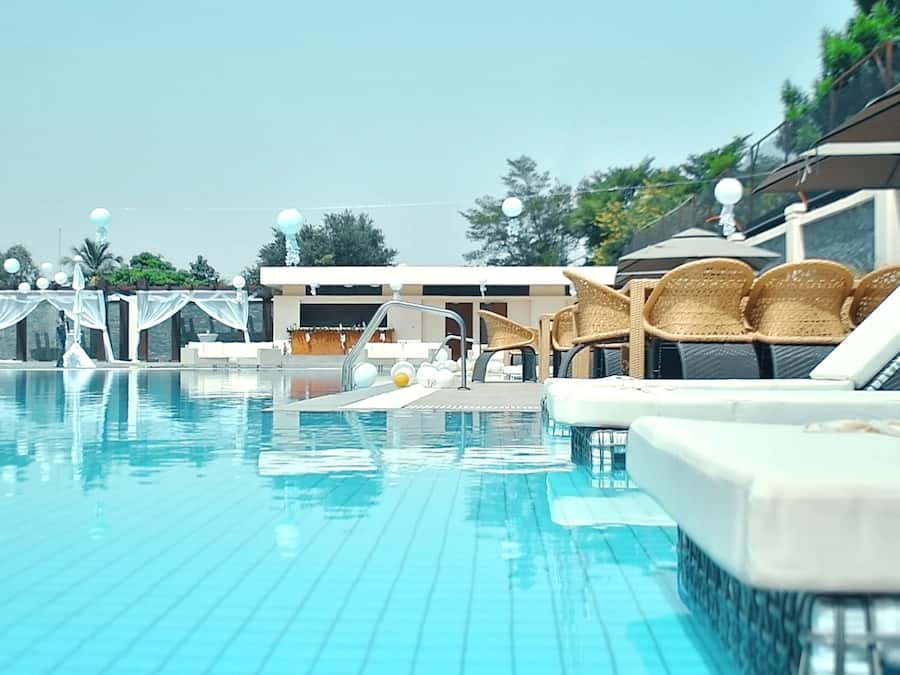 Outdoor pool, open 7:00 AM to 7:00 PM, pool umbrellas, sun loungers