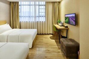 A hotel room with two beds, a desk with a chair, a television, and a window with curtains. - Jiangxia Business Hotel (Guangzhou)