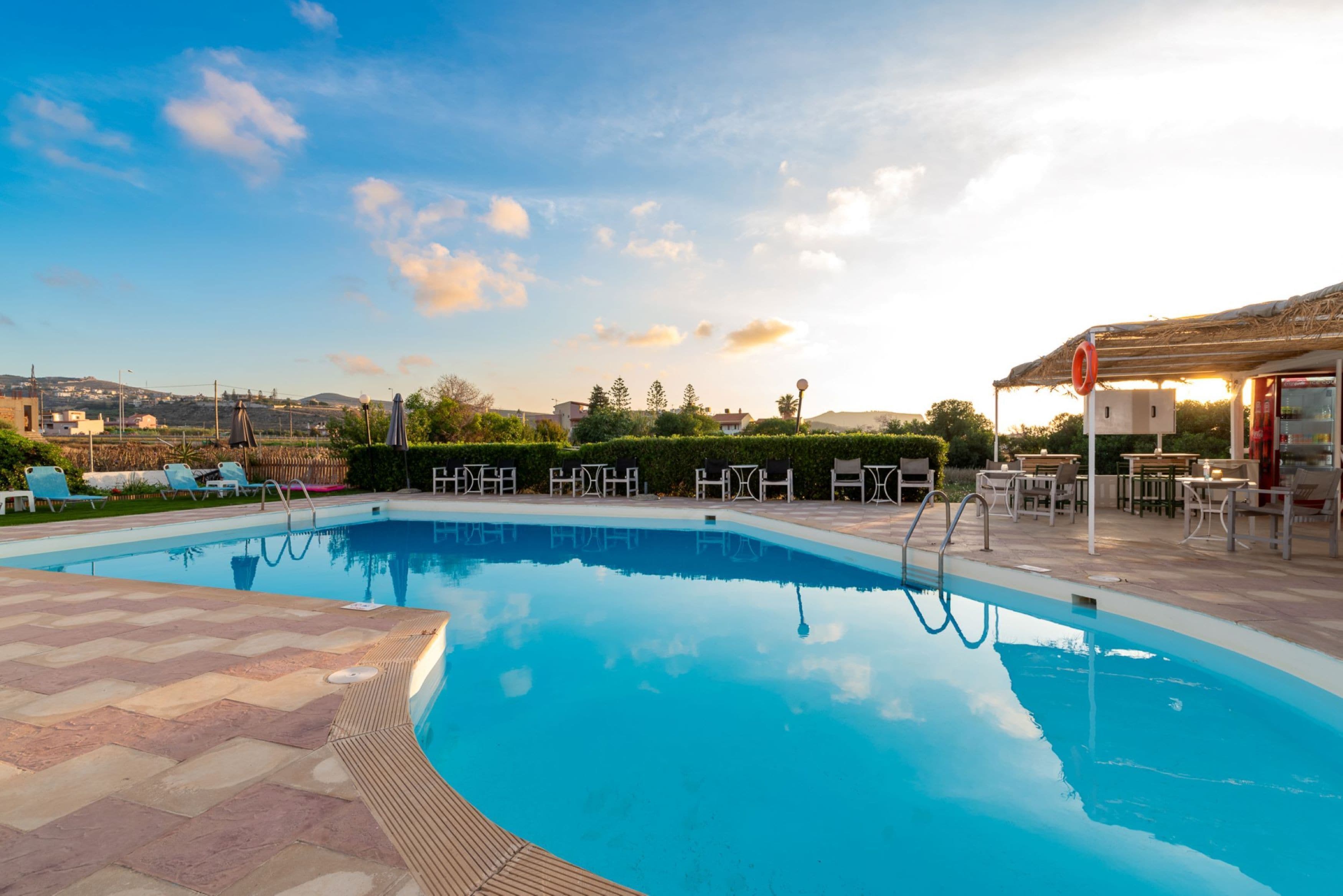 Seasonal outdoor pool, open 10:00 AM to 6:00 PM, pool umbrellas