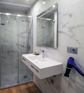 Shower, free toiletries, hair dryer, towels