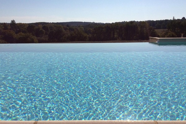 Seasonal outdoor pool, pool umbrellas, pool loungers