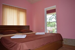 Suite estándar | Cortinas blackout, tabla de planchar con plancha y camas extra