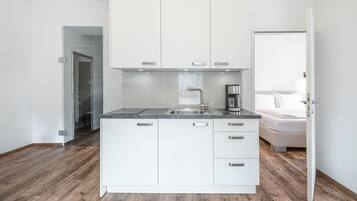 Deluxe Apartment, 1 Bedroom | Private kitchen | Fridge, microwave, stovetop, coffee/tea maker