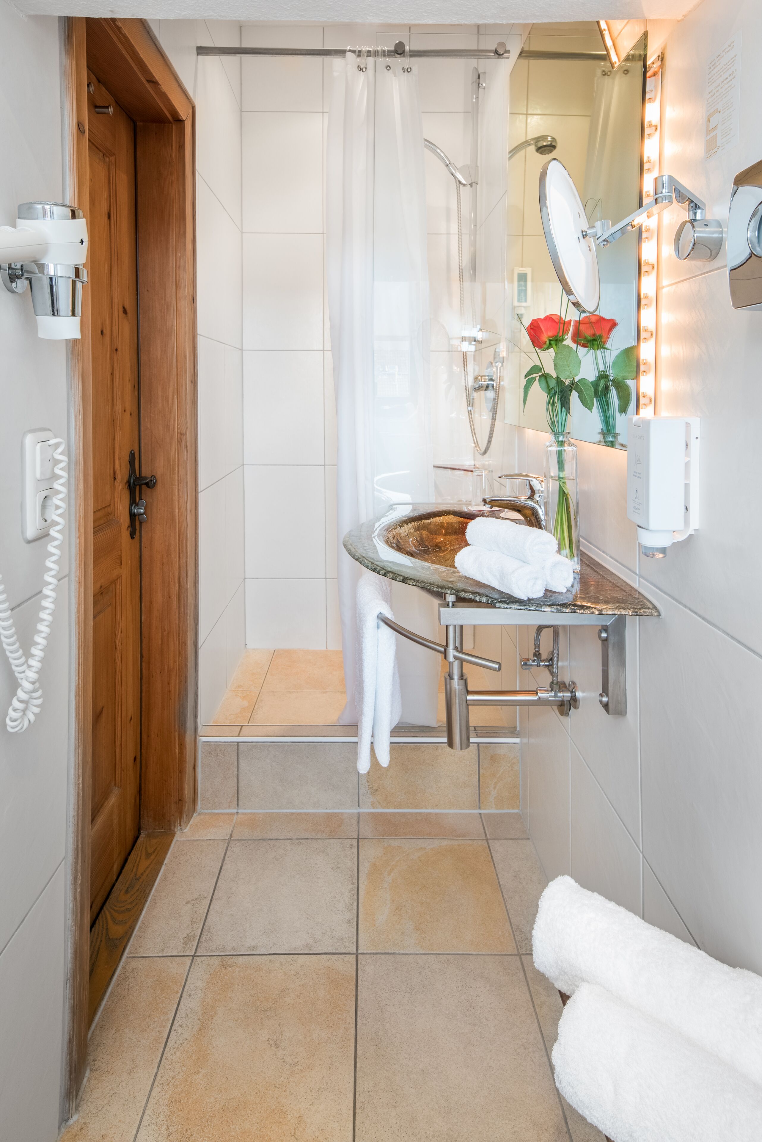 economy room | bathroom | shower, hair dryer, slippers, towels